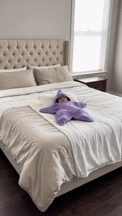 Baby Starz su un letto